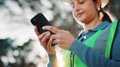 Buy stock photo Civil engineer, texting and woman with phone, outdoor or communication with contact on social media. Low angle, property development and person with mobile, message and project update on website