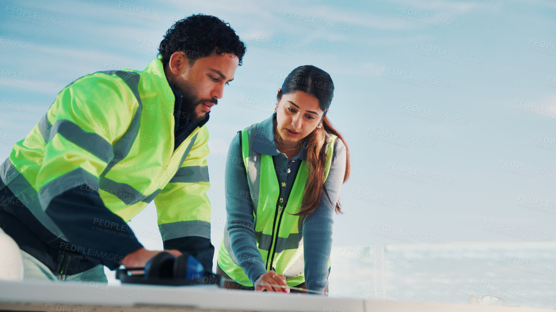 Buy stock photo Engineer, discussion and people with blueprint, outdoor or teamwork for property development on roof. Civil engineering, mockup space and colleagues with paperwork, low angle and renovation project