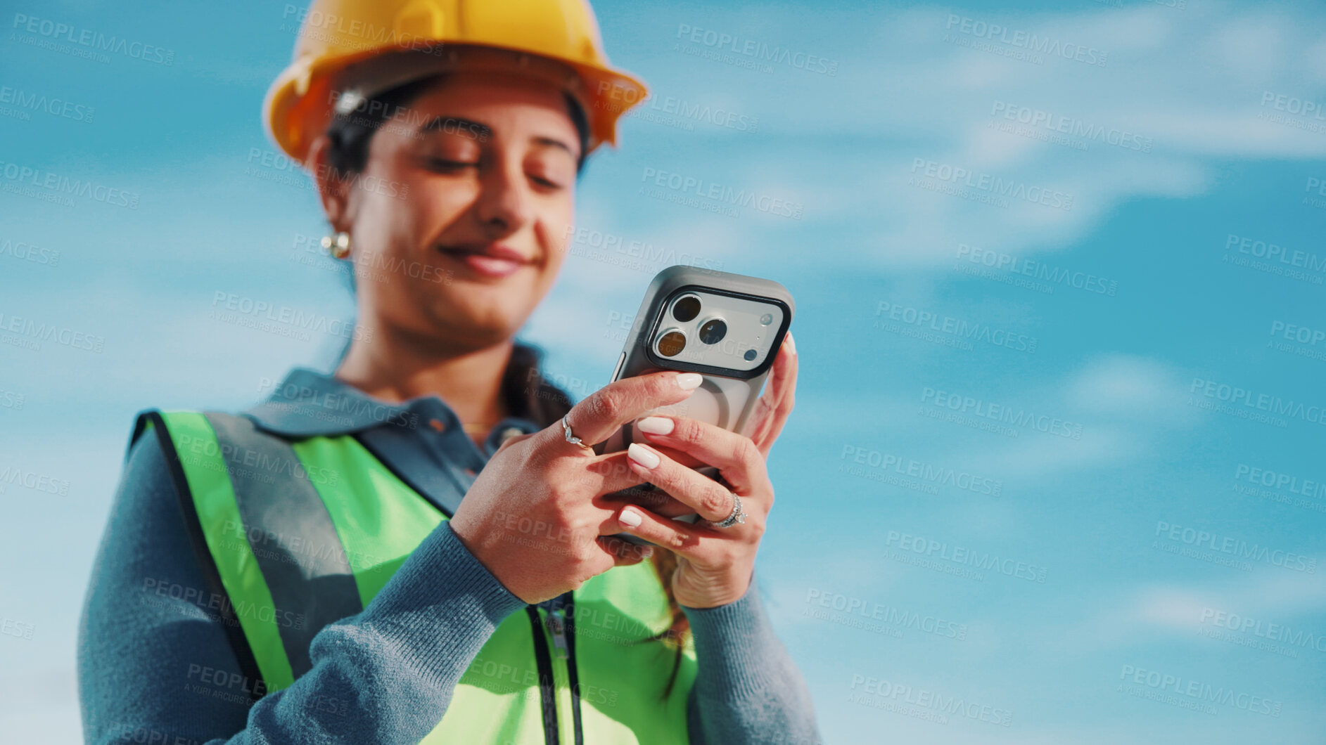 Buy stock photo Woman, engineer and outdoor with phone for contact, building planning and update schedule at space. Worker, mobile and connectivity on worksite for design feedback and reading compliance regulations