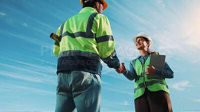 Buy stock photo Team, handshake and people with tablet on construction site, low angle or partnership for renovation. Sky, space and engineers with technology for project, collaboration and property development
