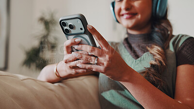 Buy stock photo Woman, hands and headphones in home with phone, social media and streaming music on platform. Person, mobile and smile in living room for unique playlist, connectivity and update app subscription