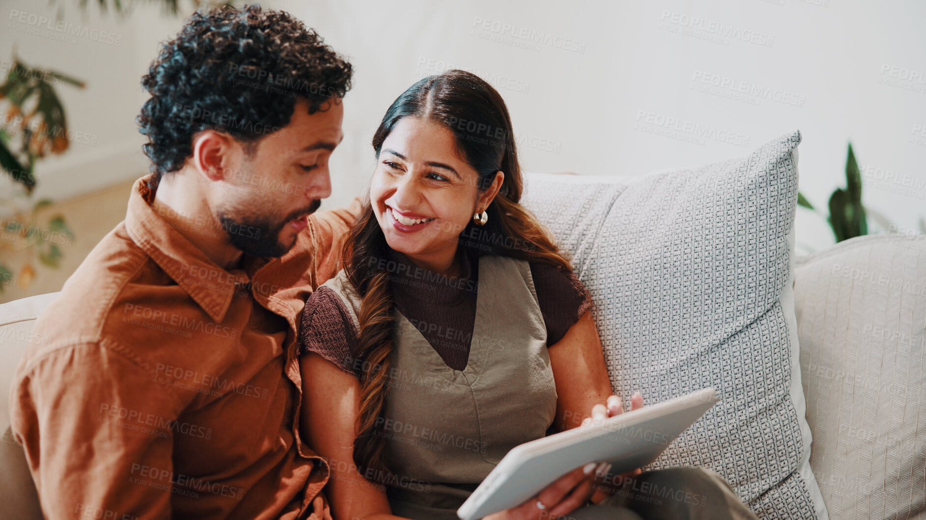 Buy stock photo Happy couple, relax and tablet in home for connectivity, bonding and quality time with streaming. Smile, together and people scroll on sofa with technology, film app or movie choice with connection