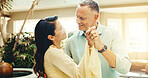 Dance, holding hands and mature couple at holiday home together for anniversary, bonding or romance. Love, music and smile with married people on summer vacation for connection, support or travel