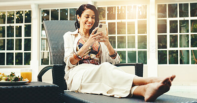 Buy stock photo Relax, typing and happy woman with phone in hotel for online communication or network connection. Mature, female person or texting with smartphone for conversation, chatting or discussion in resort