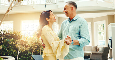 Buy stock photo Bonding, dance and mature couple at holiday home together for anniversary, love or romantic getaway. Happy. holding hands and music with married people on vacation for connection, support or travel