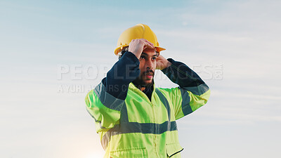 Buy stock photo Construction worker, thinking and man with helmet, outdoor and pride for renovation project or idea. Sky, mockup space and person with hardhat, reflection and decision for property development