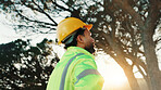 Builder, thinking and man with helmet, outdoor or ideas for renovation project on construction site. Laborer, low angle and person with hardhat, reflection and decision for property development