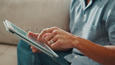 Buy stock photo Man, hands and relax in home with tablet, social media and platform subscription for online news. Person, technology and scroll in living room to find article, connectivity and check notification