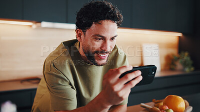 Buy stock photo Recipe, food or happy man in kitchen with phone, digital lesson or cooking tip in meal prep. Smile, nutrition or person in home with tech, online instruction or virtual tutorial for culinary activity