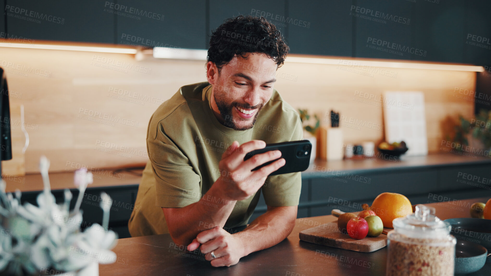 Buy stock photo Recipe, nutrition or happy man in kitchen with phone, digital lesson or cooking tip in meal prep. Smile, food or person in home with tech, online instruction or virtual tutorial for culinary activity