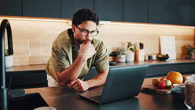 Buy stock photo Man, thinking and cooking in kitchen with laptop, glasses or watch online video for breakfast recipe. Person, problem solving and meal prep in home with computer, food blog and planning in morning.
