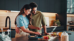 Couple, breakfast and meal prep in kitchen with fruits, bonding together and nutrition for wellness. Married people, ingredients and healthy food in home with embrace, diet and assistance for recipe.