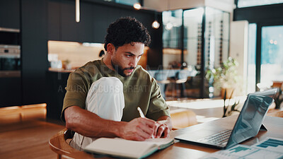Buy stock photo Man, writing and remote work in house with laptop, data analytics and review financial performance. Freelance analyst, person and taking notes in home with computer, graphs or stats for finance audit