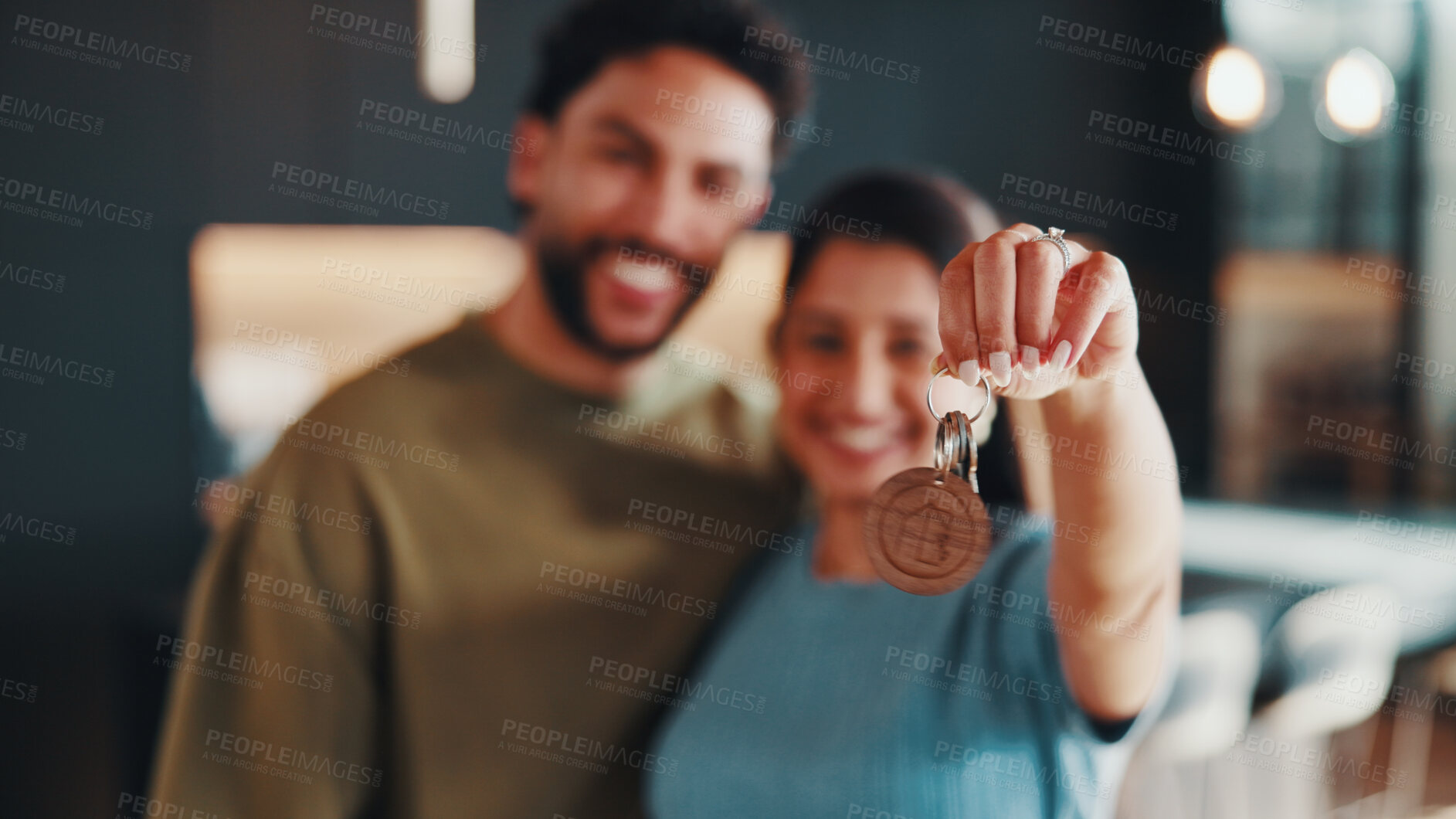 Buy stock photo Hand, key and couple moving in new home with security, property investment and support for purchase. Portrait, married people and happy in dream house with keychain, safety and relocation together.