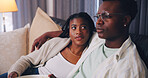 Streaming, love and couple in house with snack, movie binge or watching tv on weekend break. Relax, connection or black people with popcorn, series subscription or bonding with entertainment activity