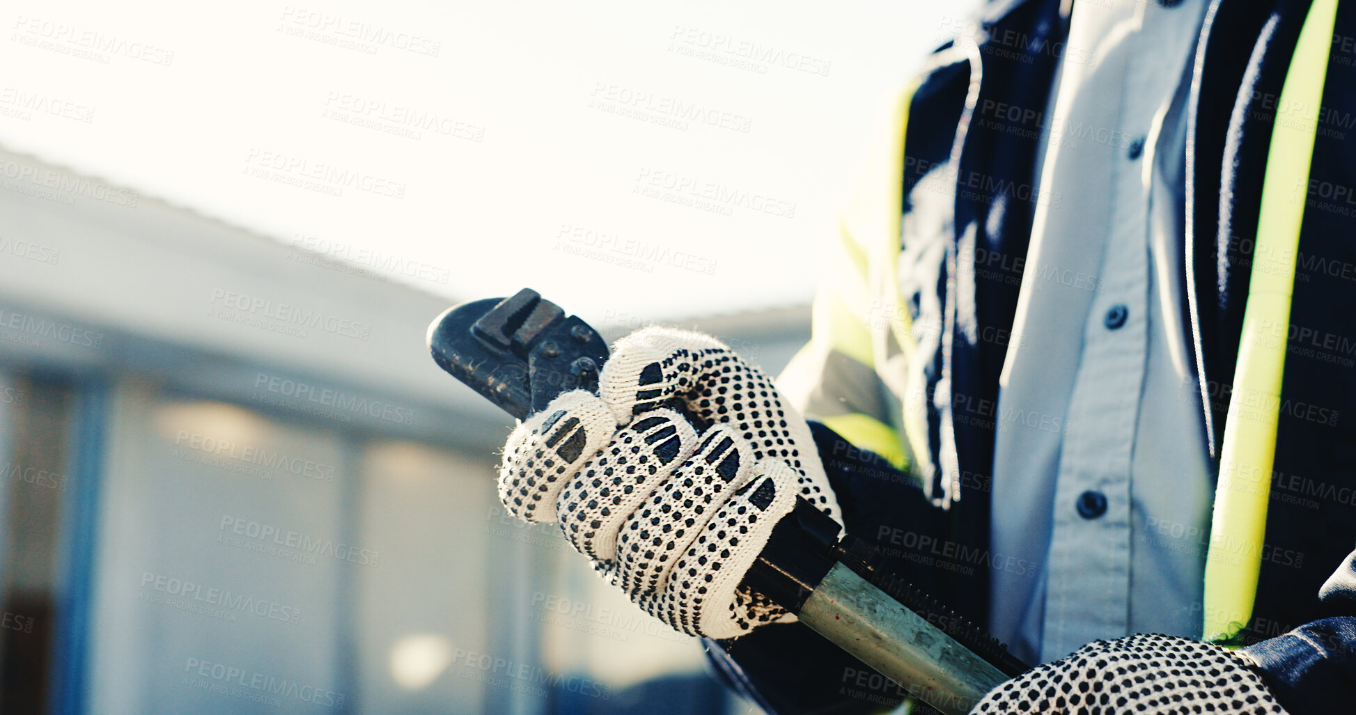 Buy stock photo Hands, wrench and worker at site for construction, property development and ready for renovation. Person, safety gloves and tool for building maintenance, manual labor and start project outdoor