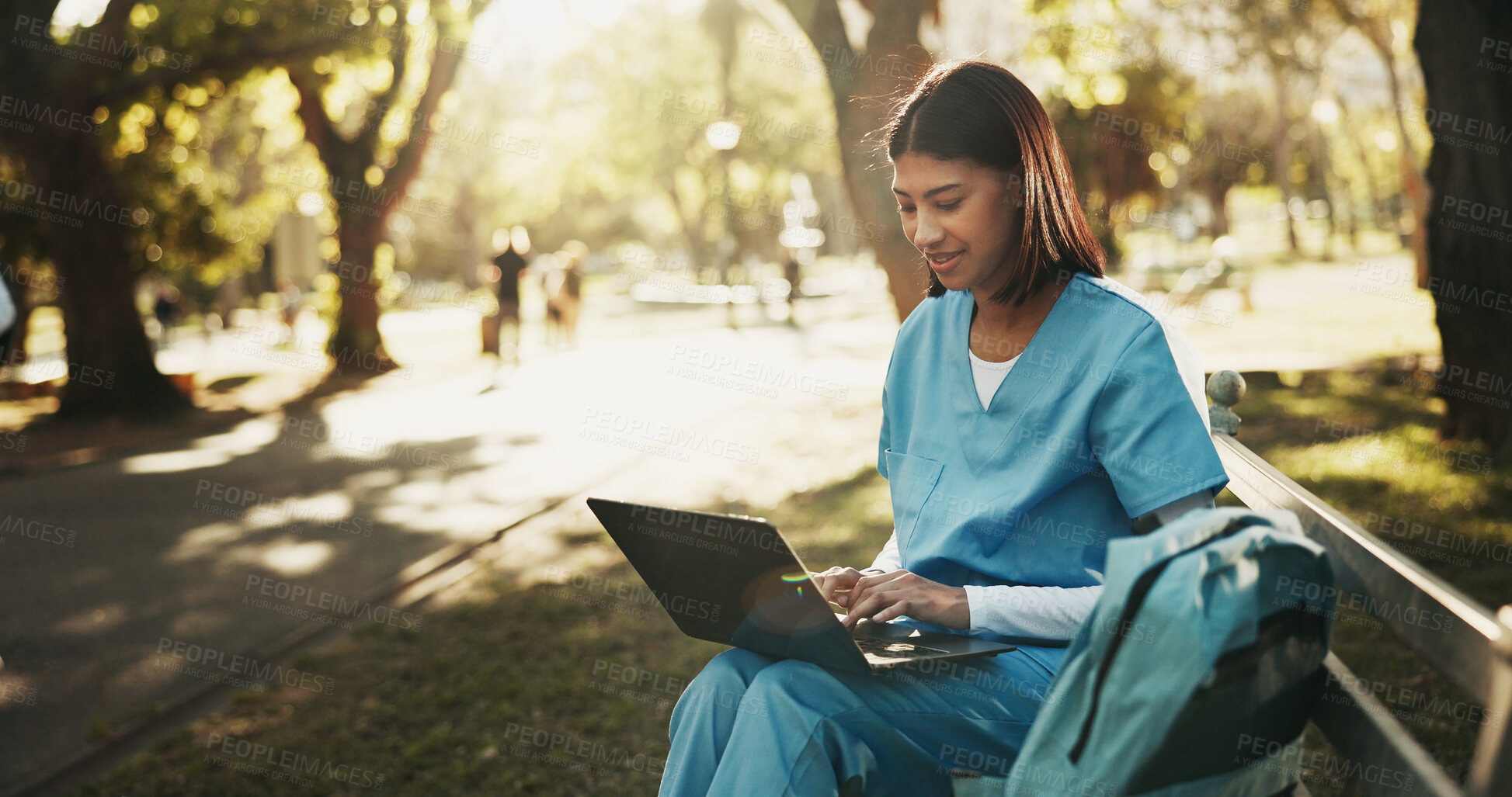 Buy stock photo Laptop, medical student and woman at park for learning, research or course module assignment. Computer, happy person and healthcare trainee on bench outdoor, education review or nurse typing report