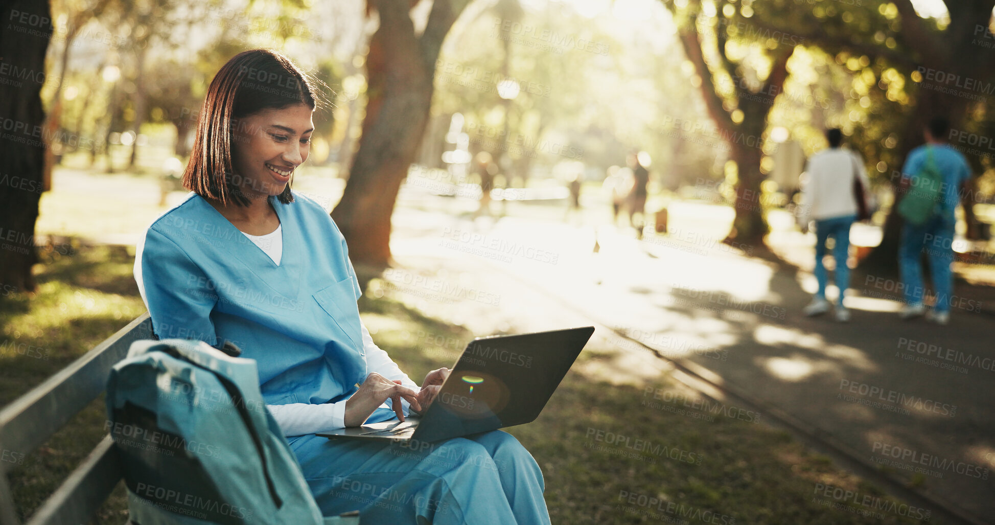 Buy stock photo Laptop, medical student and woman at park for education, research feedback or course module report. Computer, happy person and trainee nurse on bench outdoor, learning or typing healthcare review
