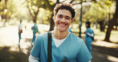 Buy stock photo Man, nurse and medical student with smile outdoor for scholarship development, wellness or portrait. Healthcare, intern and happy male person at park, residency and education at nursing school