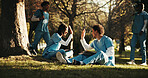 People, nurse and high five in outdoor park for teamwork, winning or medical success together. Man, woman or friends with achievement for nursing internship or acceptance on grass field in nature