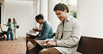 Typing, waiting and man with laptop for recruitment, interview or hiring process for onboarding. Smile, candidate and paperless on tech for opportunity, job vacancy or meeting at creative agency