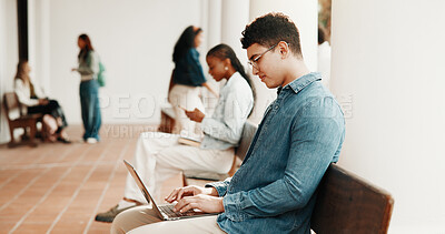 Buy stock photo University, typing and man with laptop at campus for education, assignment and research for essay. Student, school and person on computer for learning, assessment and digital study notes at college