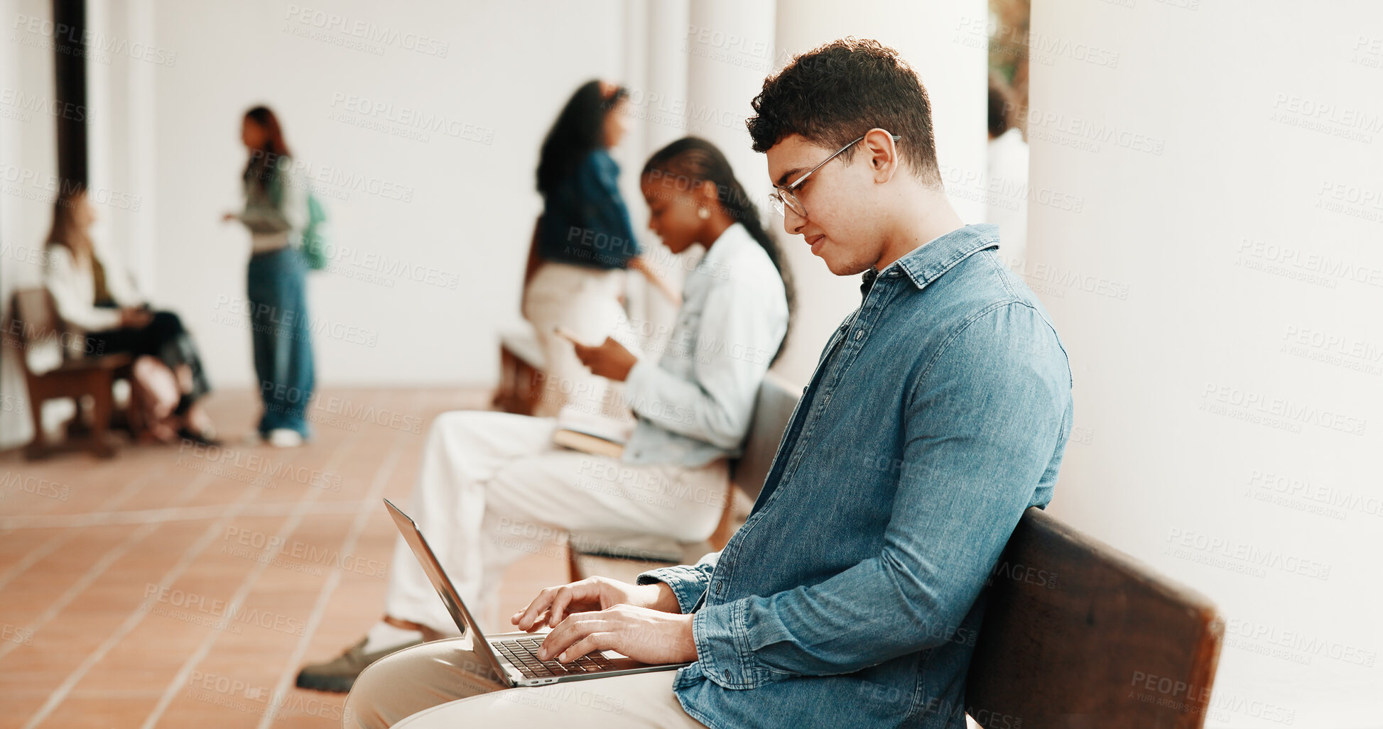 Buy stock photo University, typing and man with laptop at campus for education, assignment and research for essay. Student, school and person on computer for learning, assessment and digital study notes at college
