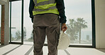 Engineer, back or hand with safety helmet at construction site, development compliance or protection. PPE, legs and person with hard hat, building protocol or hazard prevention gear with risk control