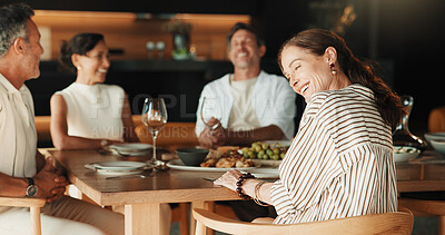 Buy stock photo Woman, laugh and friends at dinner party in house, bonding together and social gathering on weekend. Happy mature people, relax and conversation with meal, connection and reunion on break in home