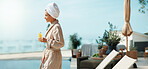 Juice, hotel and woman with drink by pool for vacation, luxury getaway and holiday on weekend. Hospitality, travel and person with mimosa, towel and robe for tourism, relax and break at resort