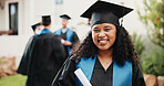 Happy, student and woman at college for graduation, academic ceremony and education success. Graduate, portrait and person at university for studying, achievement and milestone for scholarship