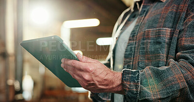 Buy stock photo Hands, man and carpenter in workshop with tablet, research and timber inventory for production. Person, reading and digital at warehouse for carpentry, inspection report and manufacturing furniture