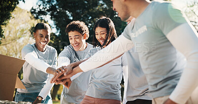 Buy stock photo Group, volunteer and happy people with hands together in park for outdoor outreach or teamwork. Excited, community service and NGO piling with stack or smile for donation mission or charity in nature