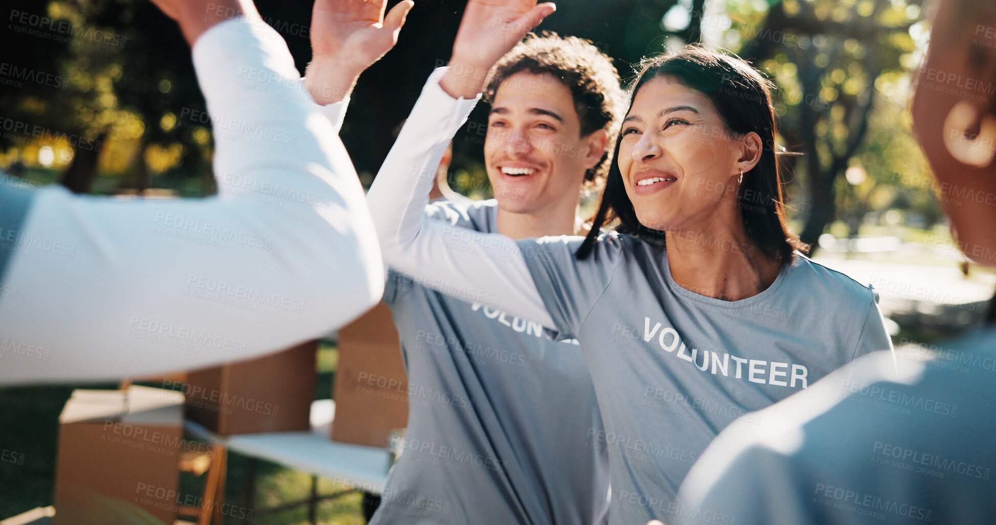 Buy stock photo Volunteer, group and park with high five for outreach success, charity or winning together in nature. Happy, NGO team or people with smile for achievement, community service mission, support or unity