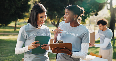 Buy stock photo Volunteer, tablet and women with clipboard for talking, planning and grocery list for donation. Outdoor, team and people with tech, checklist and inventory for food drive, aid and charity outreach