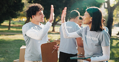 Buy stock photo Volunteer, outdoor and people high five for success, clipboard and grocery quota for donation. Park, happy and men with women celebrate for food drive, collection victory and aid for charity outreach