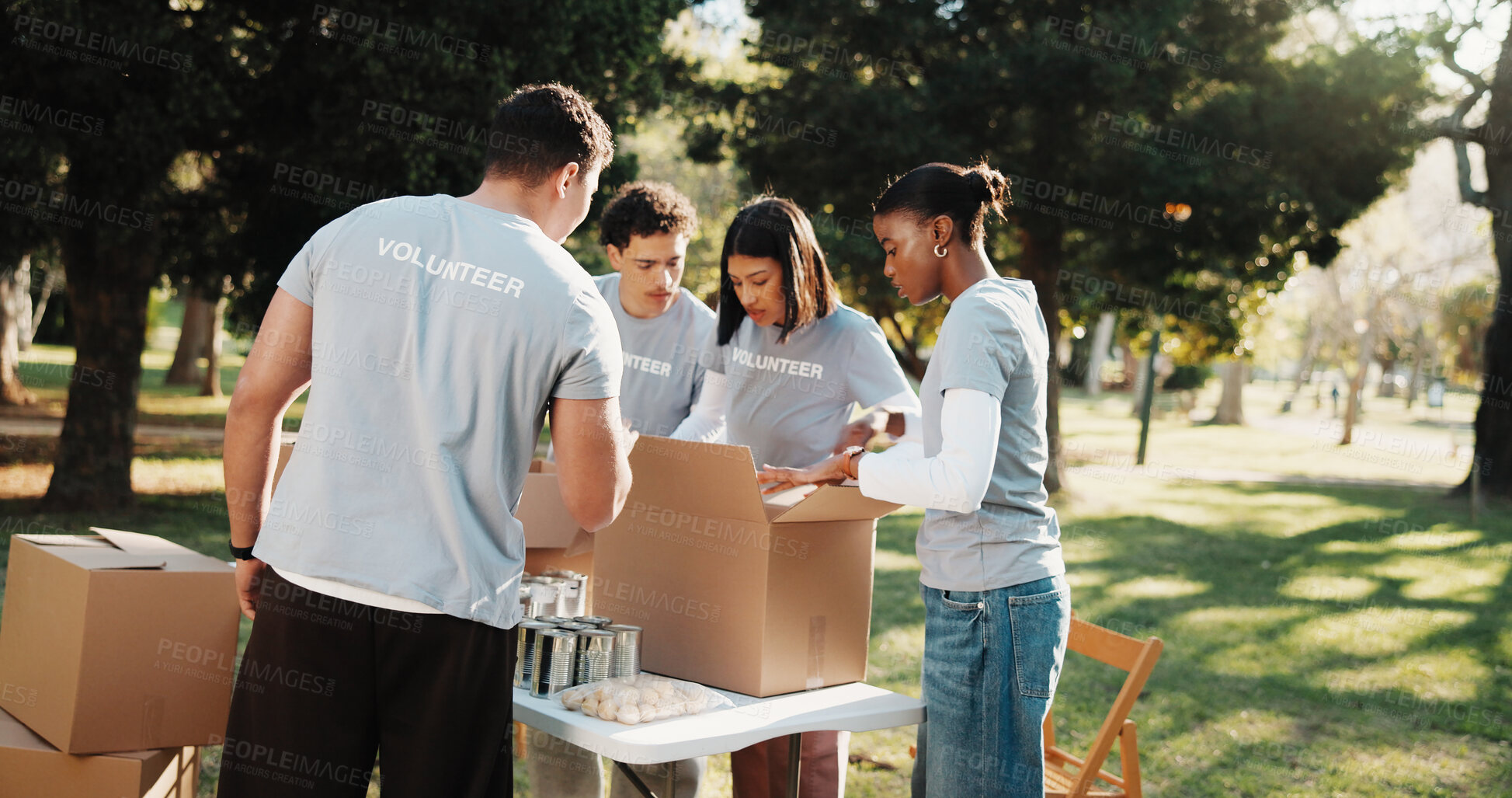 Buy stock photo Volunteer, team and people outdoor with box for charity program, outreach and non profit event. Ngo, community and men with women with parcel for collection, donation and help for food drive in park