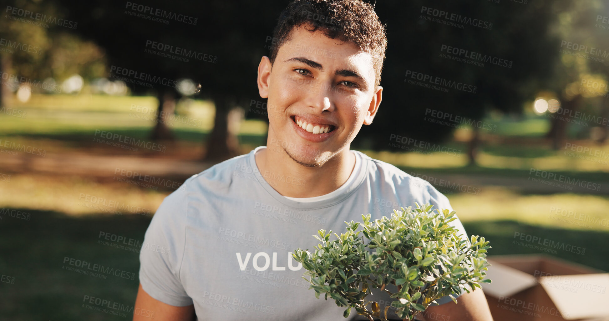 Buy stock photo Volunteer, man and smile at park for plant restoration, eco advocate and ngo for green initiative. Non profit, person or leaves portrait for community greening, environment outreach or climate action