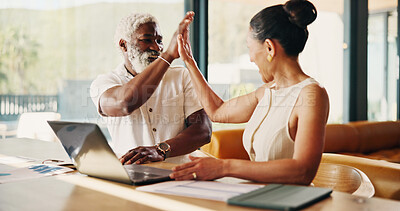 Buy stock photo Couple, man and high five in home with laptop, loan settlement or celebration for savings goal. Budget, mature interracial people or excited for credit balance, debt free pride or financial security