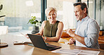 Talking, finance and mature couple on laptop for mortgage, online banking and expenses in home. Happy, marriage and man with woman with computer, financial paperwork and budget for pension saving