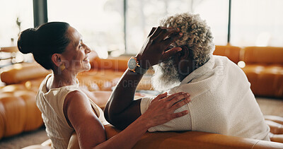Buy stock photo Love, laugh and sofa with interracial couple in home for bonding, connection and support. Commitment, relax and care with senior man and woman in living room in house for rest and weekend break