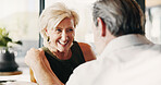Love, laughing and bonding with old couple in home for relax, connection and support. Commitment, joke and care with senior man and woman in living room in house for rest, happy and weekend break