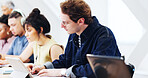 University student, man and writing notes with tablet, education assignment or knowledge research. Tech, college and person study with notebook in class, test preparation and learning in lesson