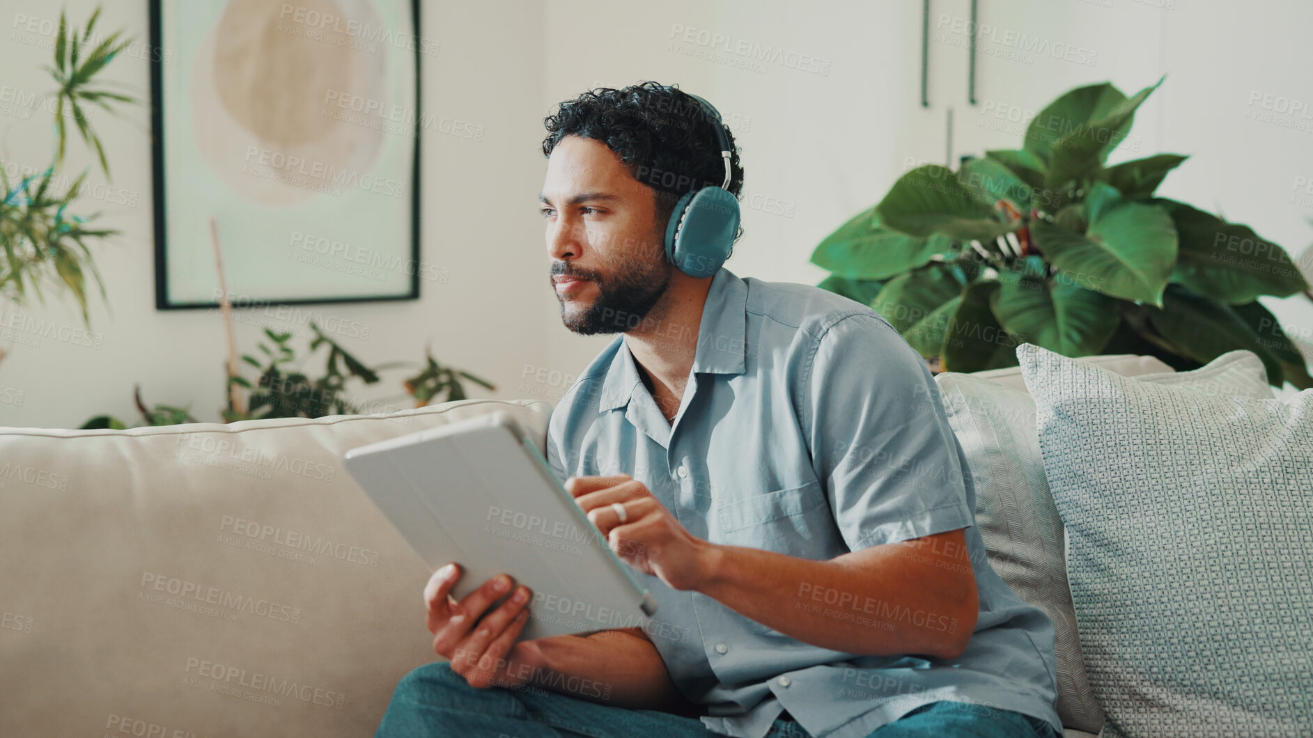 Buy stock photo Man, thinking and headphones or tablet on home sofa for streaming music, podcast or subscription. Idea, audio playlist and male person relax on couch with mobile app, technology and sound online