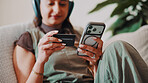 Woman, hands and phone in house with credit card, set up digital wallet or payment for subscription. Person, tech and mobile banking on couch with website, EFT and purchase for streaming service.