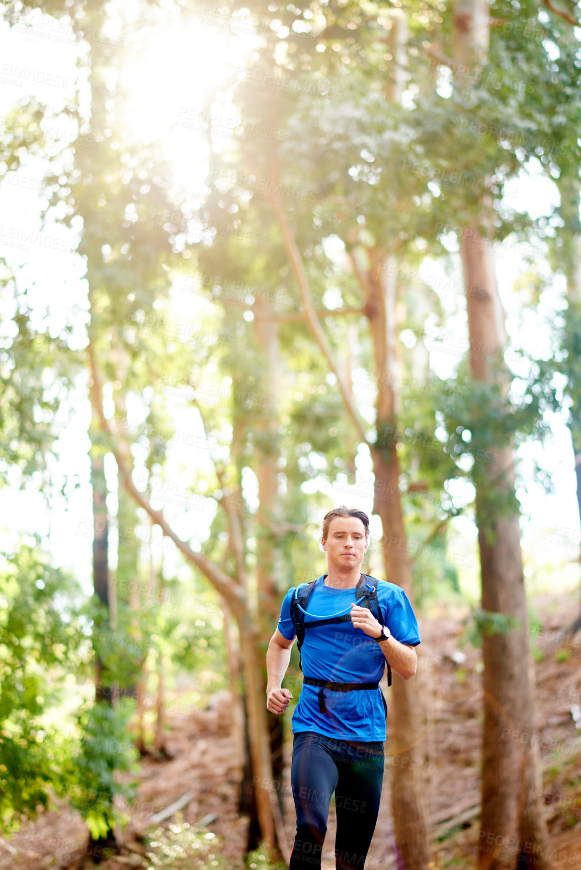 Buy stock photo Fitness, running and sports with man in forest for cardio training, marathon routine or workout. Exercise, performance and speed with athlete or runner outdoor in mountains for challenge or health