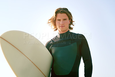 Buy stock photo Surfboard, portrait and man by beach for exercise, training or holiday activity for wellness. Fitness, swimsuit and male athlete by ocean for surfing, workout or water sports on tropical vacation.