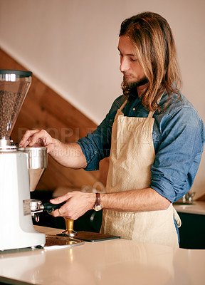 Buy stock photo Man, barista and machine for coffee at cafe to prepare espresso, fresh brew and beverage process. Male person, equipment and server ground beans for latte, customer service and hospitality industry
