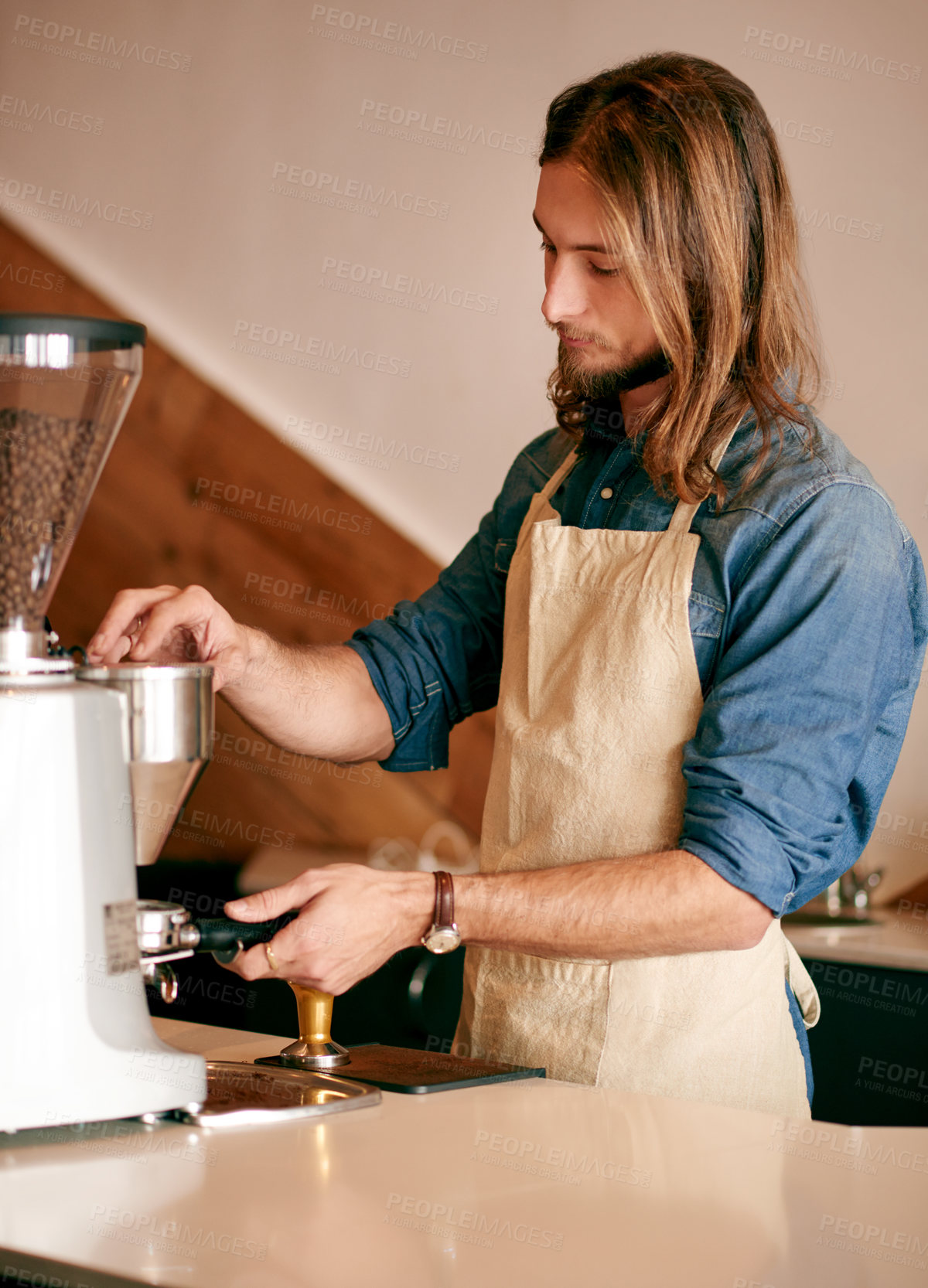 Buy stock photo Man, barista and machine for coffee at cafe to prepare espresso, fresh brew and beverage process. Male person, equipment and server ground beans for latte, customer service and hospitality industry
