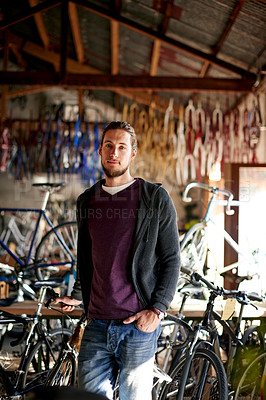 Buy stock photo Man, portrait and technician in bike repair shop for maintenance, confidence and garage. Bicycle, mechanic and service with a professional handyman for startup, small business and workshop for fixing